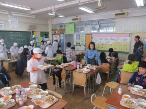 Students at Sanyo Elementary in Tokyo serve lunch